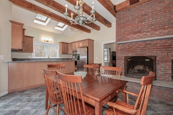 9 Crockett Road Upton, MA 01757 - Photo 11 of 22 a dining room with a wooden table and chairs