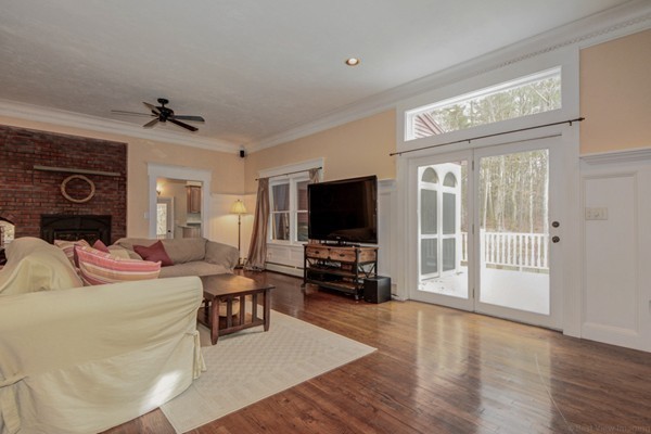 9 Crockett Road Upton, MA 01757 - Photo 13 of 22 a living room with furniture and a flat screen tv