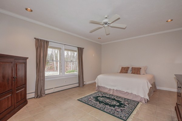 9 Crockett Road Upton, MA 01757 - Photo 15 of 22 a living room with a couch and dresser