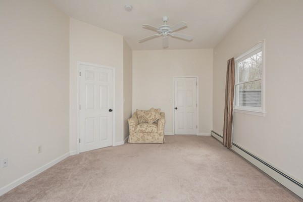 9 Crockett Road Upton, MA 01757 - Photo 20 of 22 an empty room with fan