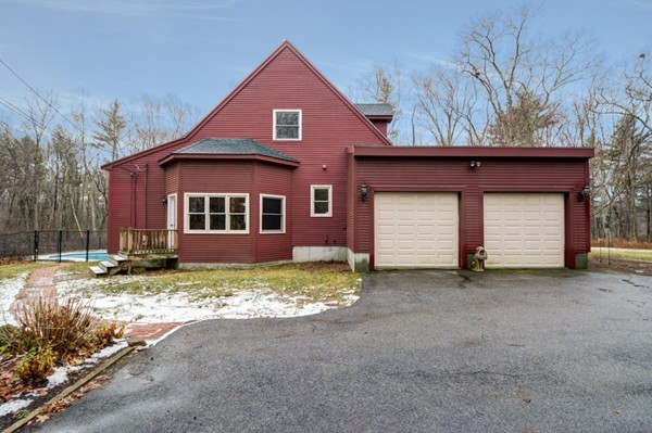 9 Crockett Road Upton, MA 01757 - Photo 2 of 22 a view of a house with a yard and garage