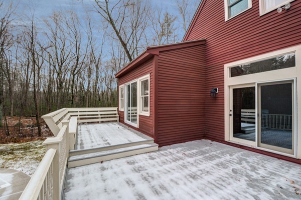 9 Crockett Road Upton, MA 01757 - Photo 4 of 22 a backyard of a house with wooden floor and fence