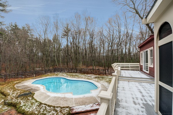 9 Crockett Road Upton, MA 01757 - Photo 6 of 22 a view of a swimming pool with a patio