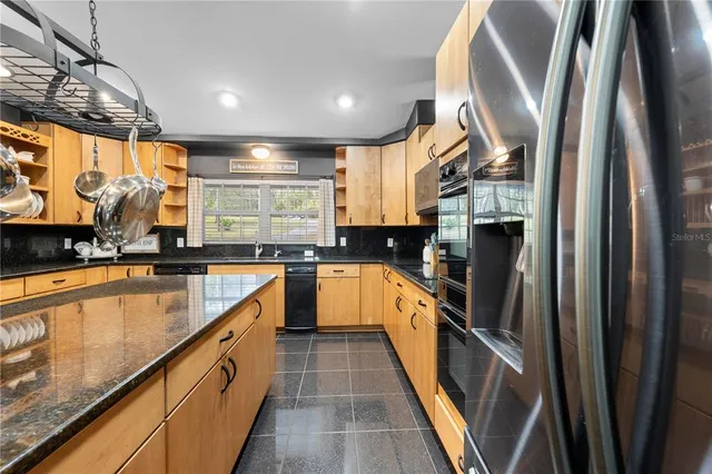 a bedroom with a bed and a view of bathroom