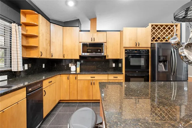 a kitchen with a sink and a window