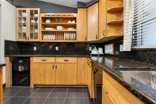 a large kitchen with a table and chairs