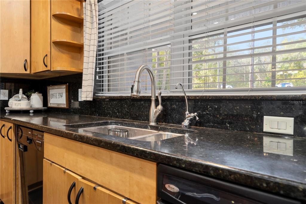 4244 Bessemer Road Brooksville, FL 34602 - Photo 19 of 56 a kitchen with a sink and a window