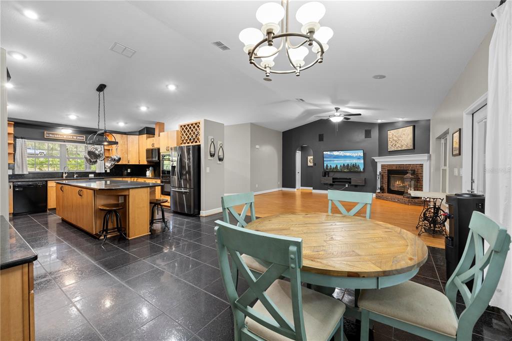 4244 Bessemer Road Brooksville, FL 34602 - Photo 21 of 56 a large kitchen with a table and chairs