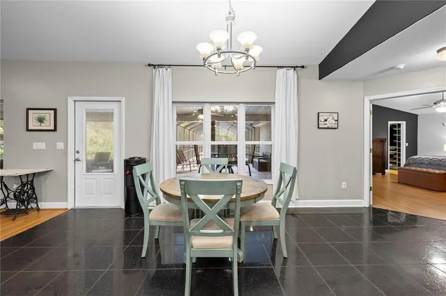 a living room with furniture and a ceiling fan