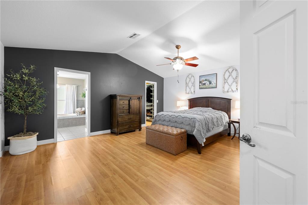 4244 Bessemer Road Brooksville, FL 34602 - Photo 25 of 56 a bedroom with a bed and a view of bathroom