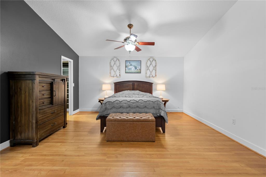 4244 Bessemer Road Brooksville, FL 34602 - Photo 26 of 56 a living room with furniture and a ceiling fan