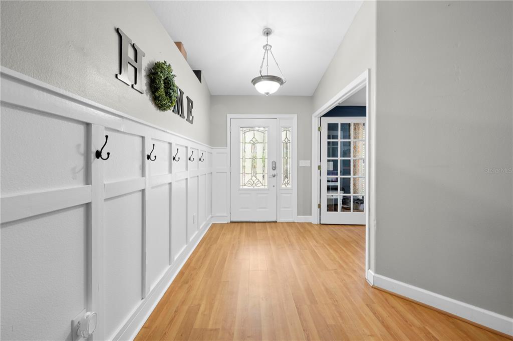 4244 Bessemer Road Brooksville, FL 34602 - Photo 39 of 56 a view of an entryway with wooden floor