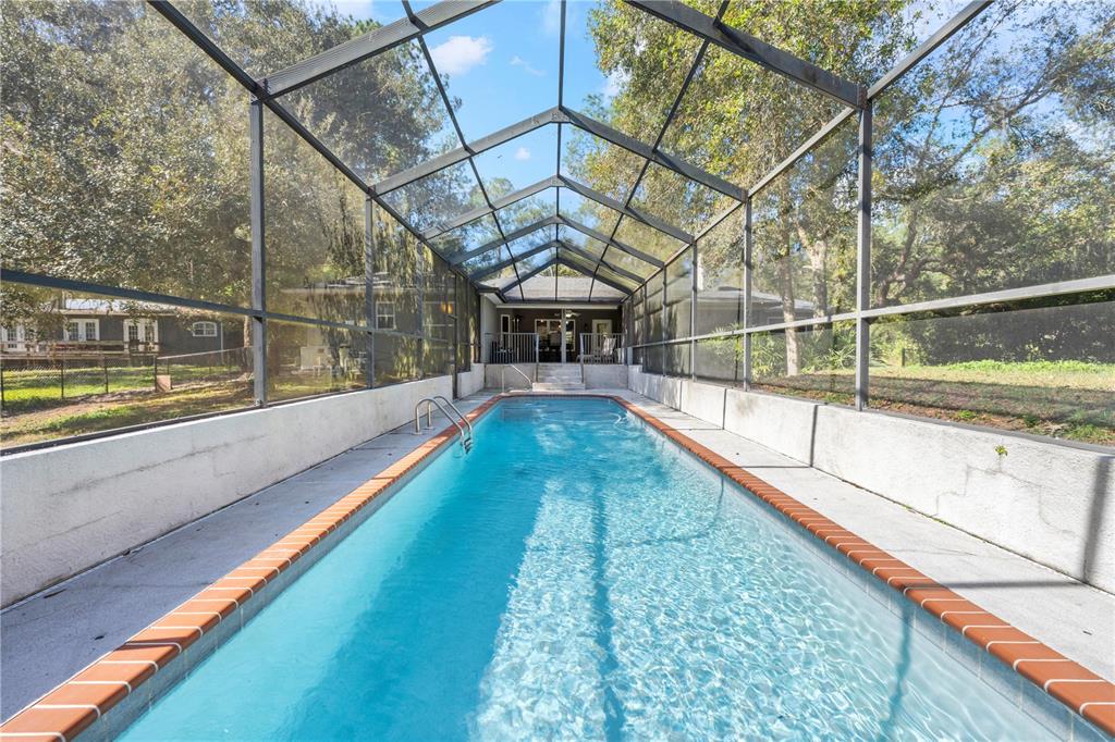 4244 Bessemer Road Brooksville, FL 34602 - Photo 4 of 56 a view of a bathroom with a swimming pool