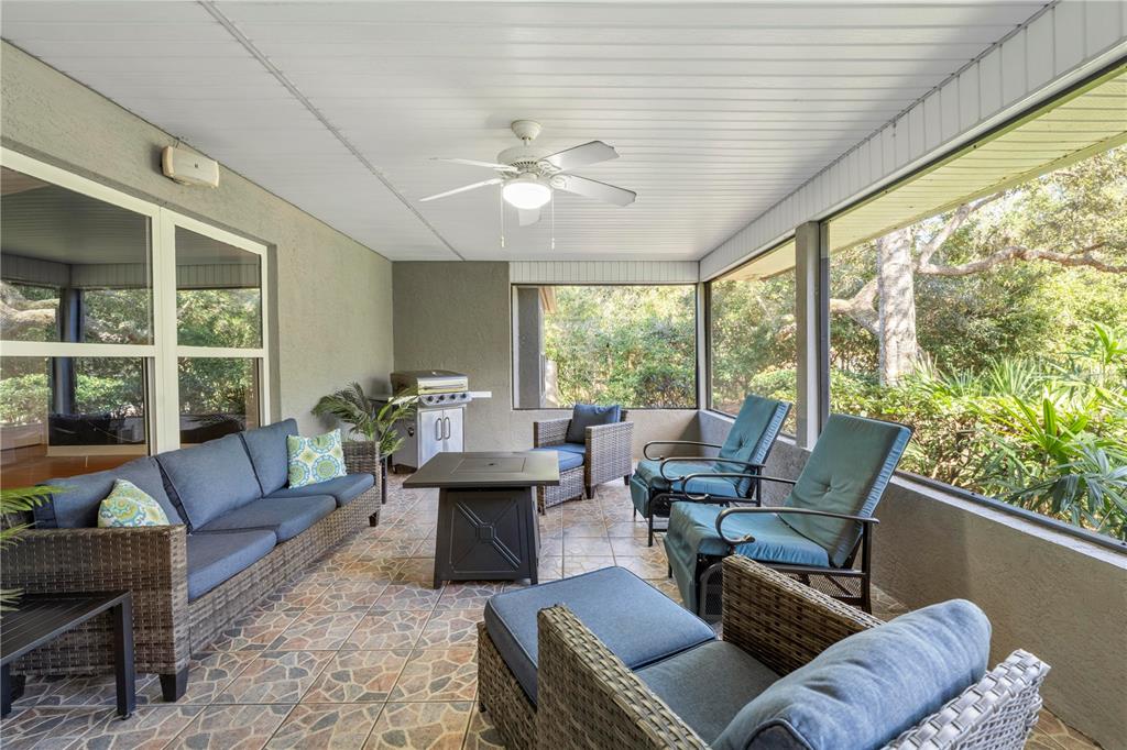 4244 Bessemer Road Brooksville, FL 34602 - Photo 47 of 56 a living room with furniture and a large window