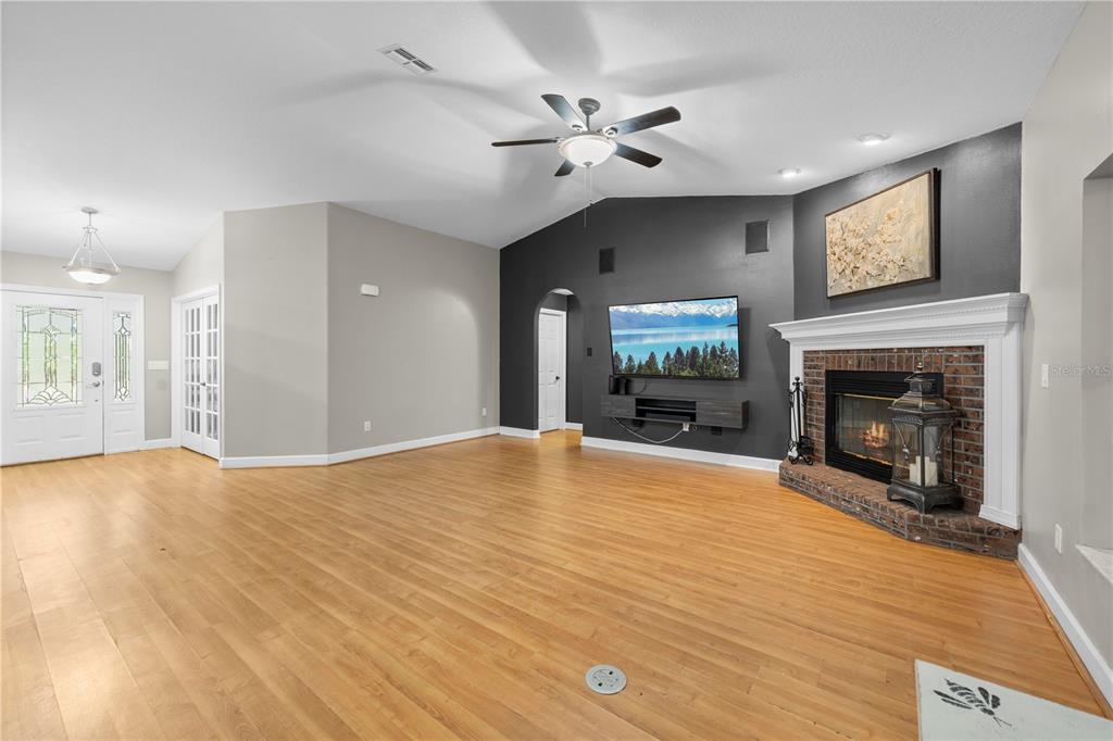 4244 Bessemer Road Brooksville, FL 34602 - Photo 5 of 56 a view of empty room with a fireplace