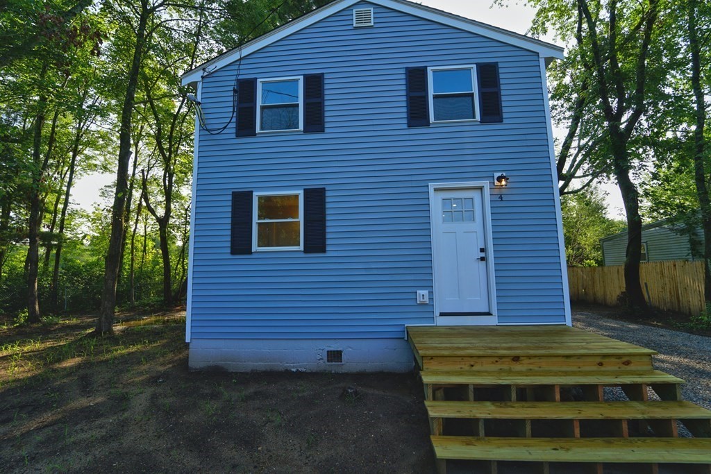 4 Juniper Road Holbrook, MA 02343 - Photo 1 of 27 a front view of a house with a garden