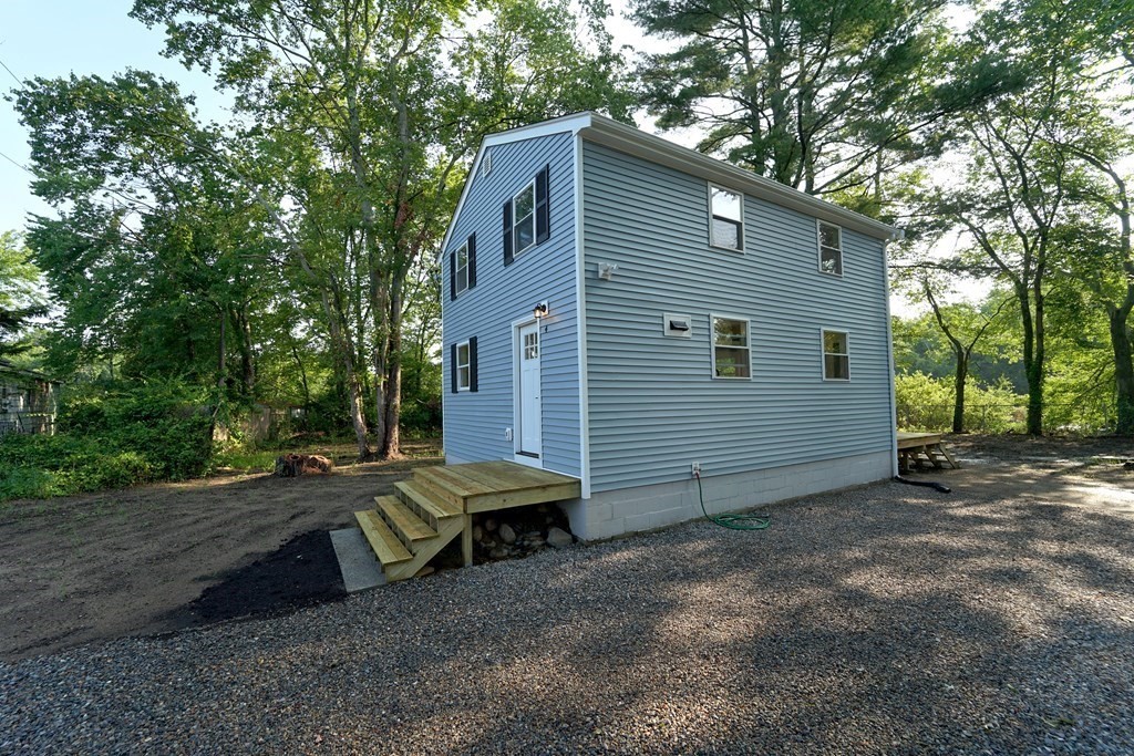 4 Juniper Road Holbrook, MA 02343 - Photo 2 of 27 a view of a house with a yard