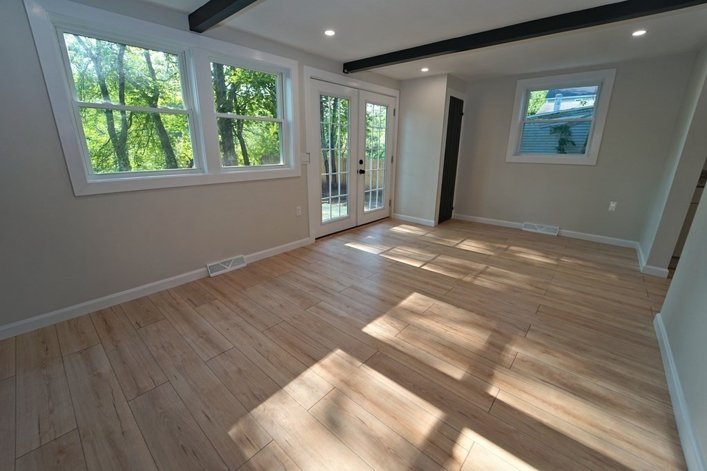 4 Juniper Road Holbrook, MA 02343 - Photo 21 of 27 an empty room with wooden floor and windows