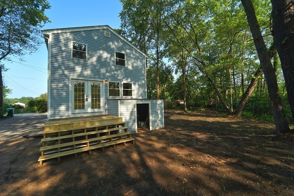 4 Juniper Road Holbrook, MA 02343 - Photo 23 of 27 a front view of a house with a yard
