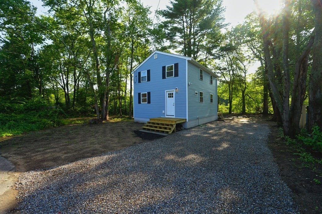 4 Juniper Road Holbrook, MA 02343 - Photo 3 of 27 a front view of a house with a yard