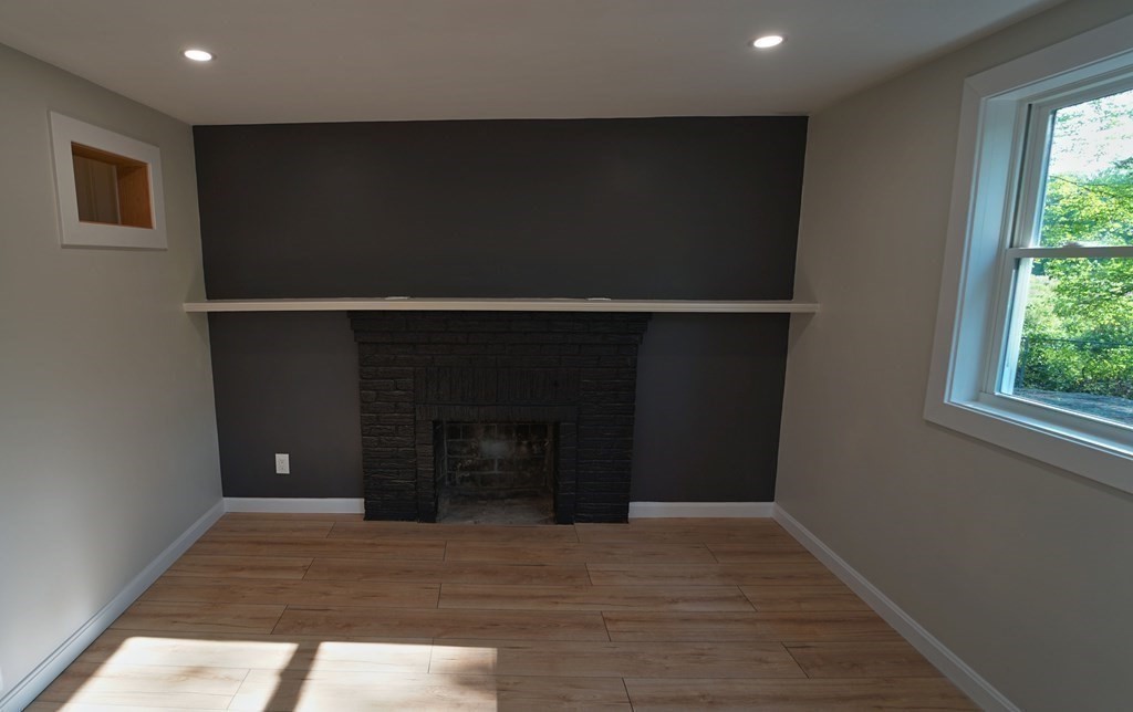 4 Juniper Road Holbrook, MA 02343 - Photo 5 of 27 a view of empty room with window and fireplace