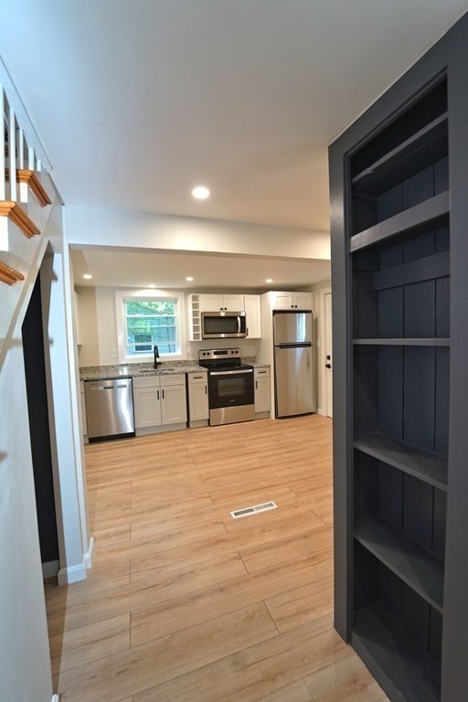 4 Juniper Road Holbrook, MA 02343 - Photo 9 of 27 a view of living room with cabinets and refrigerator