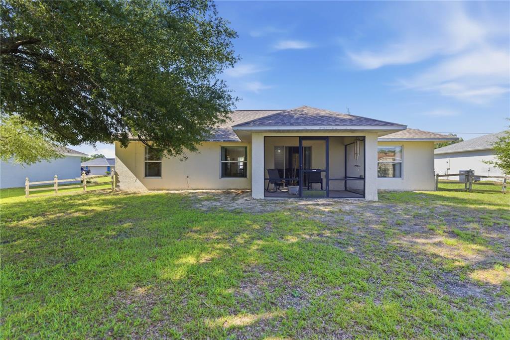 3959 Southwest 129th Street Ocala, FL 34473 - Photo 21 of 27 a view of a house with a yard