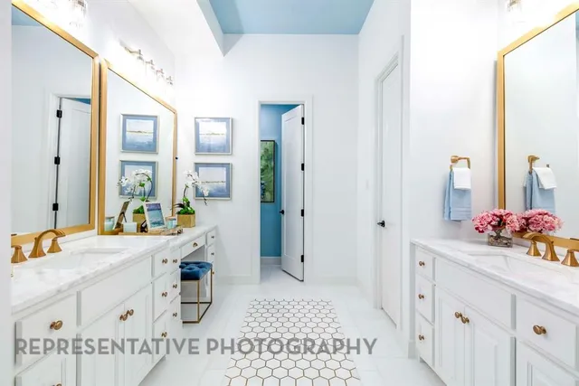 a spacious bathroom with a sink mirror and shower