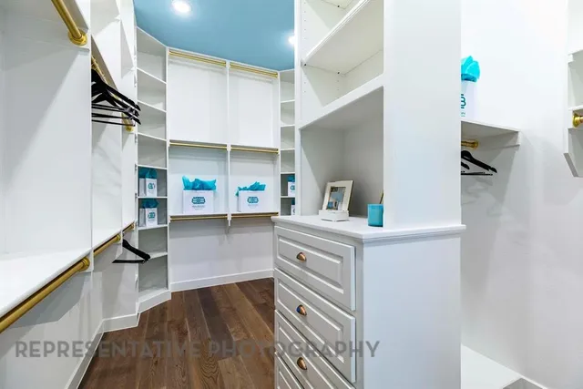 a view of kitchen with cabinets and wooden floor