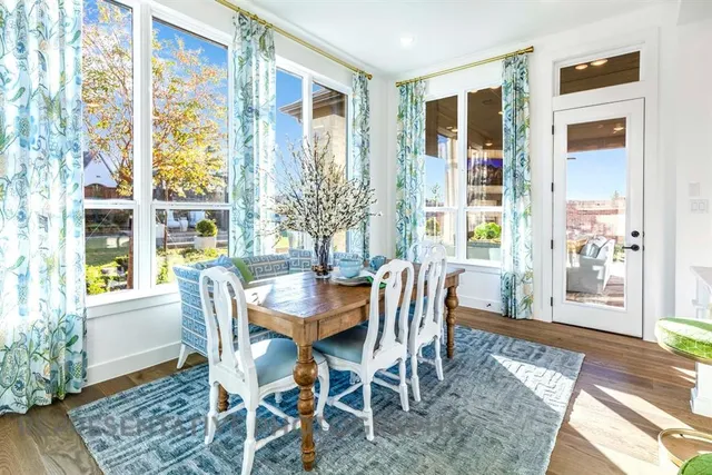 a view of a dining room with furniture wooden floor and a rug