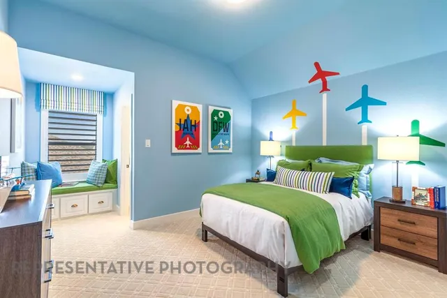 a bedroom with a bed a dresser next to a window