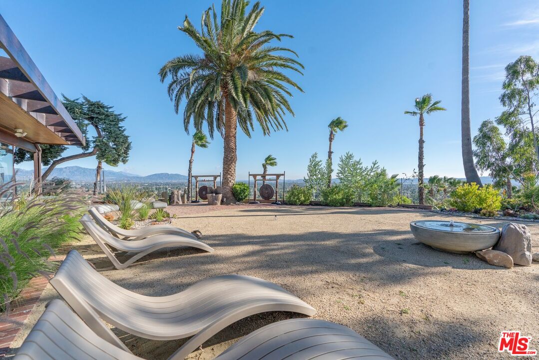 17728 Ridgeway Road Granada Hills, CA 91344 - Photo 14 of 18 a swimming pool with outdoor seating and plants