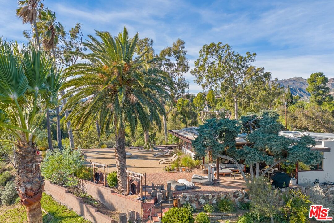 17728 Ridgeway Road Granada Hills, CA 91344 - Photo 4 of 18 a view of a palm trees in front of the house