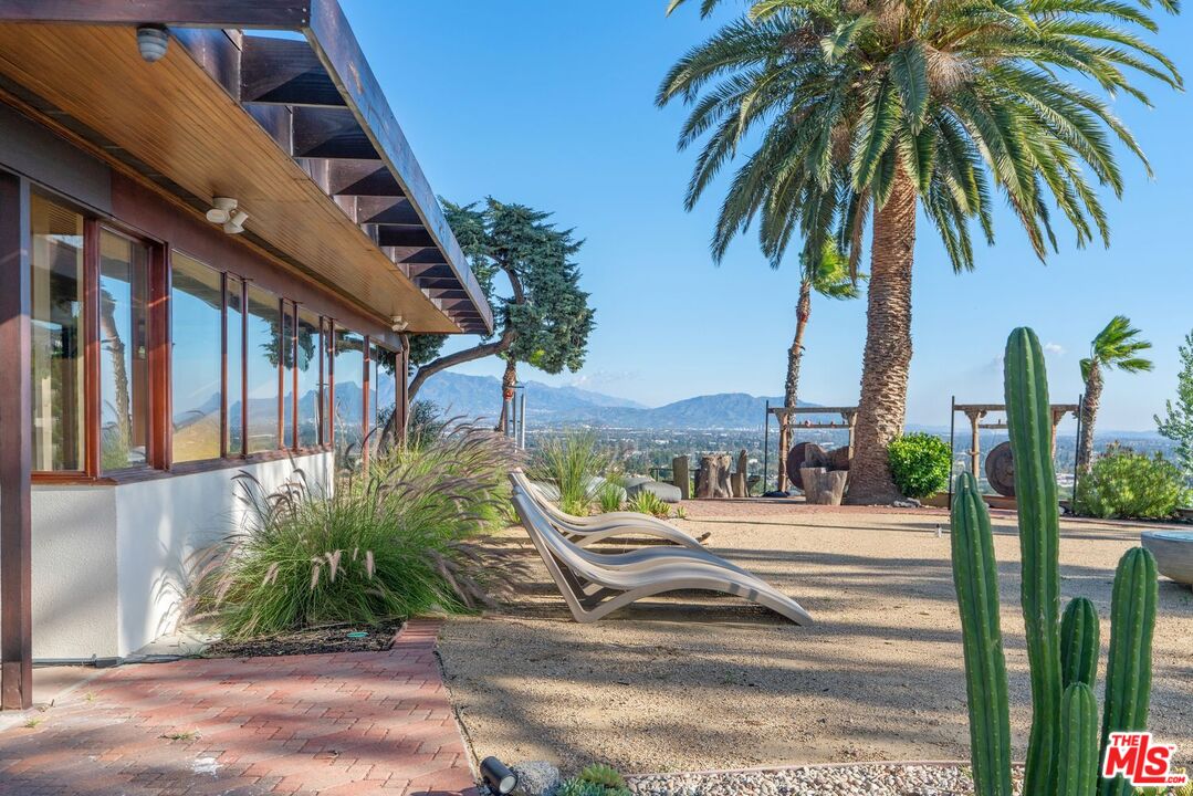 17728 Ridgeway Road Granada Hills, CA 91344 - Photo 7 of 18 a view of a palm tree with flower garden
