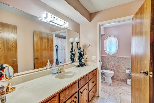 a bathroom with a sink double vanity and a mirror