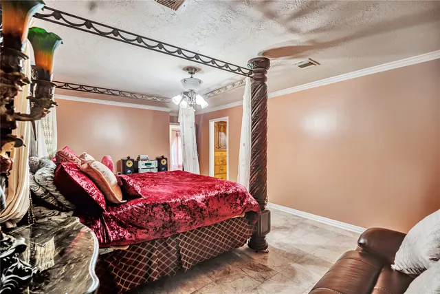 a bedroom with a bed window and walk in closet