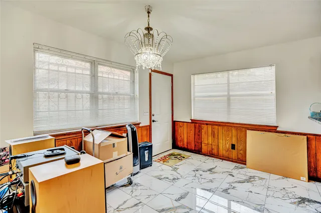 a bed room with a bed and a window