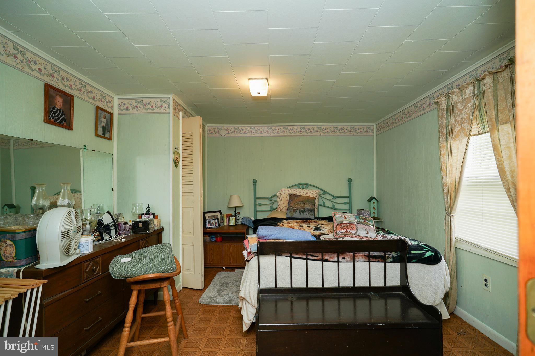 128 Woolens Road Elkton, MD 21921 - Photo 13 of 23 a bedroom with furniture and a window