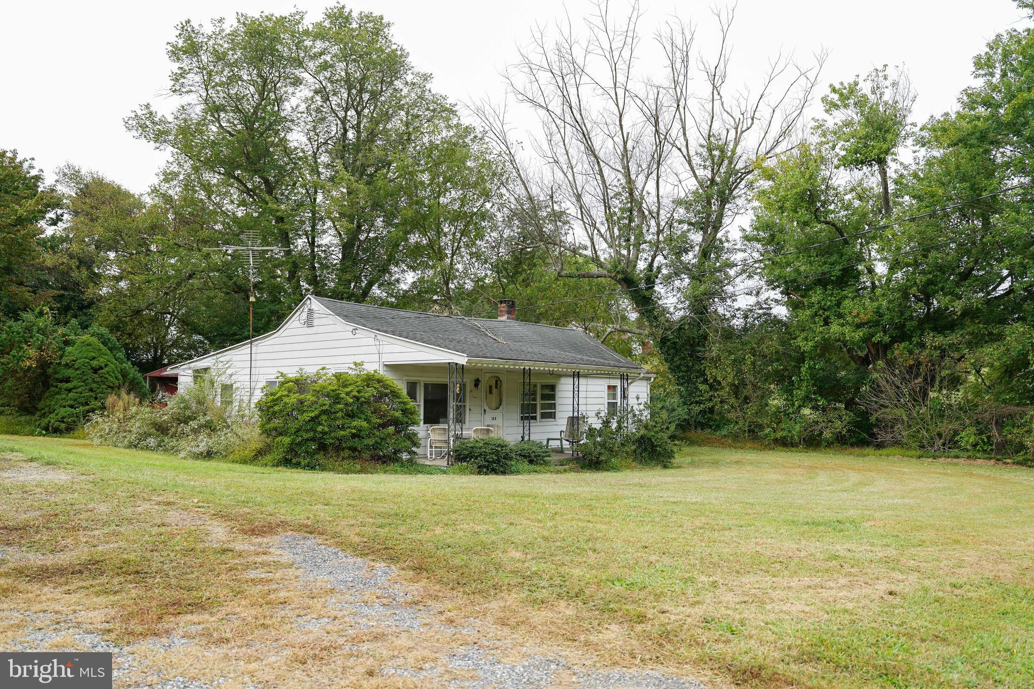 128 Woolens Road Elkton, MD 21921 - Photo 8 of 23 a front view of a house with a yard