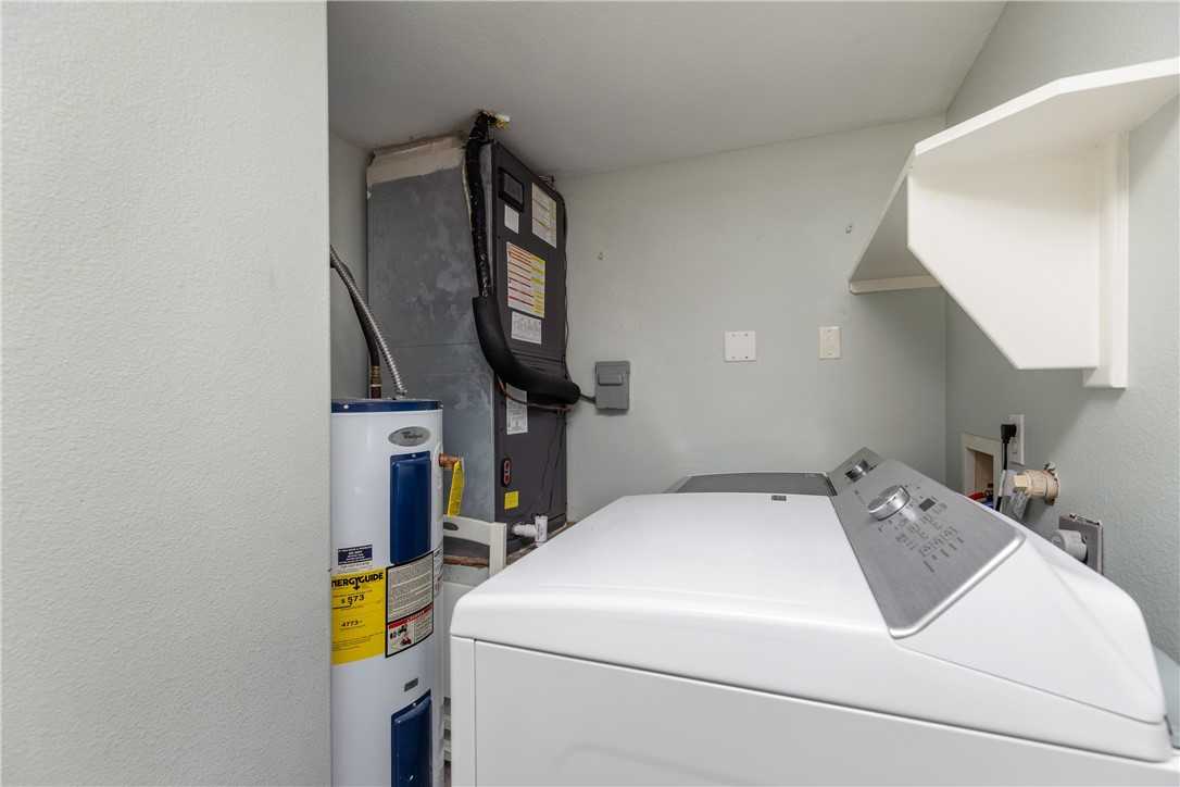 15409 Salt Cay Court, Unit F Corpus Christi, TX 78418 - Photo 13 of 35 a utility room with dryer and washer
