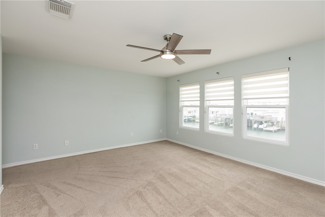 15409 Salt Cay Court, Unit F Corpus Christi, TX 78418 - Photo 21 of 35 a view of an empty room with a window
