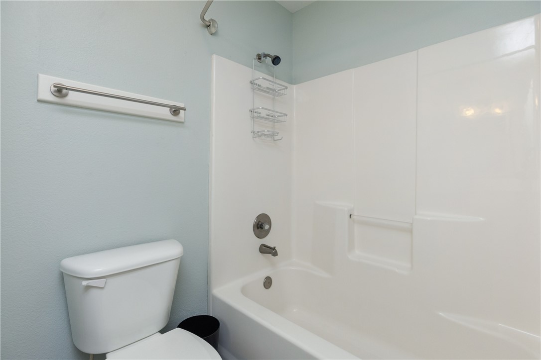15409 Salt Cay Court, Unit F Corpus Christi, TX 78418 - Photo 28 of 35 a bathroom with a toilet and a bathtub