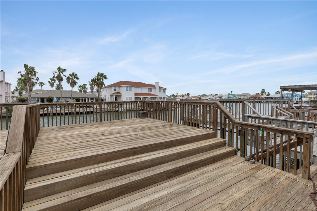 15409 Salt Cay Court, Unit F Corpus Christi, TX 78418 - Photo 29 of 35 a balcony with wooden floor and city view