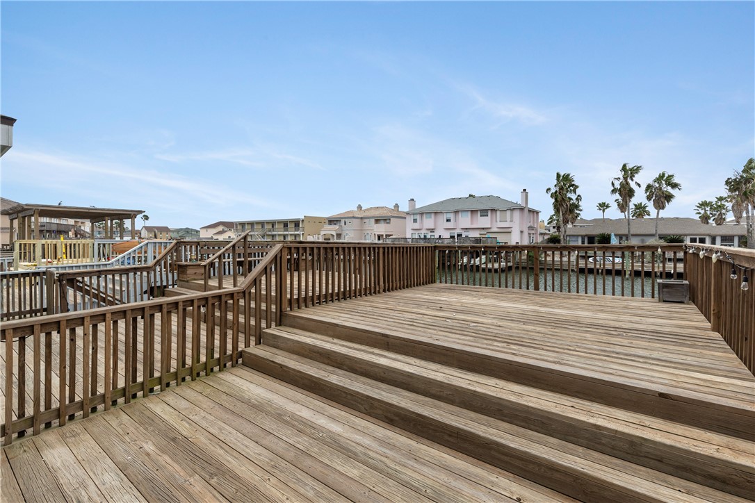 15409 Salt Cay Court, Unit F Corpus Christi, TX 78418 - Photo 30 of 35 a view of a balcony with wooden floor and city view