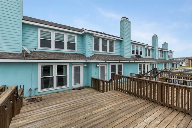 a front view of a house with deck
