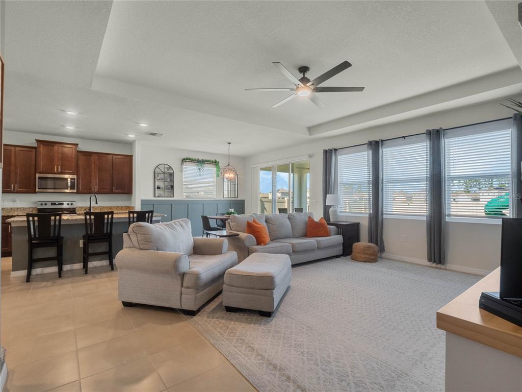 5021 Southwest 88th Street Ocala, FL 34476 - Photo 14 of 40 a living room with furniture and a large window