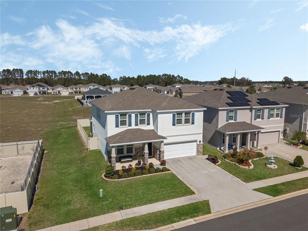 5021 Southwest 88th Street Ocala, FL 34476 - Photo 35 of 40 an aerial view of a house with yard patio and lake view