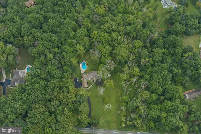 a view of a swimming pool and lounge chairs