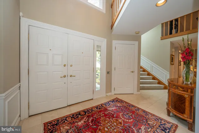 a view of an entryway with wooden floor