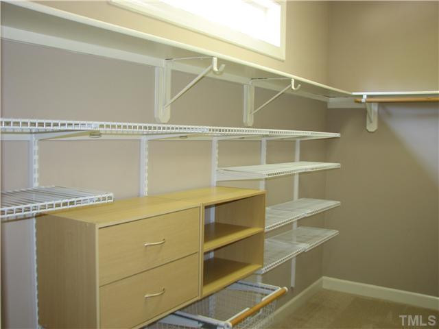 5029 Bartons Enclave Lane Raleigh, NC 27613 - Photo 16 of 25 The master closet is quite large and featues convenient built-ins for storage.